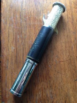 One tubular ivory and chrome Otis King calculator