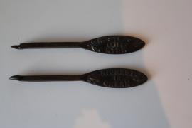 Two Nestlé tin openers.