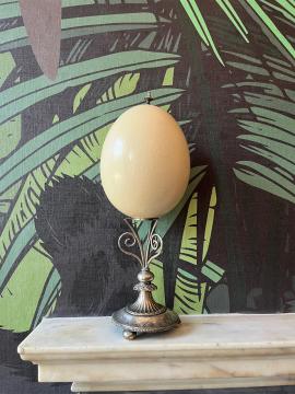Ostrich egg mounted on silver stand